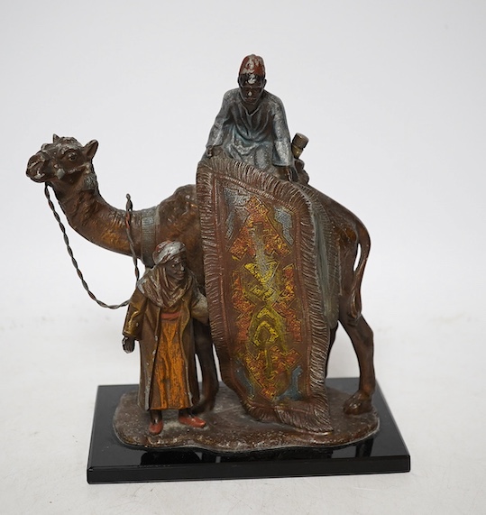 An Austrian cold painted bronze lighter in the form of a camel and two figures, approximately 17cm wide. Condition - worn in places, unchecked if working